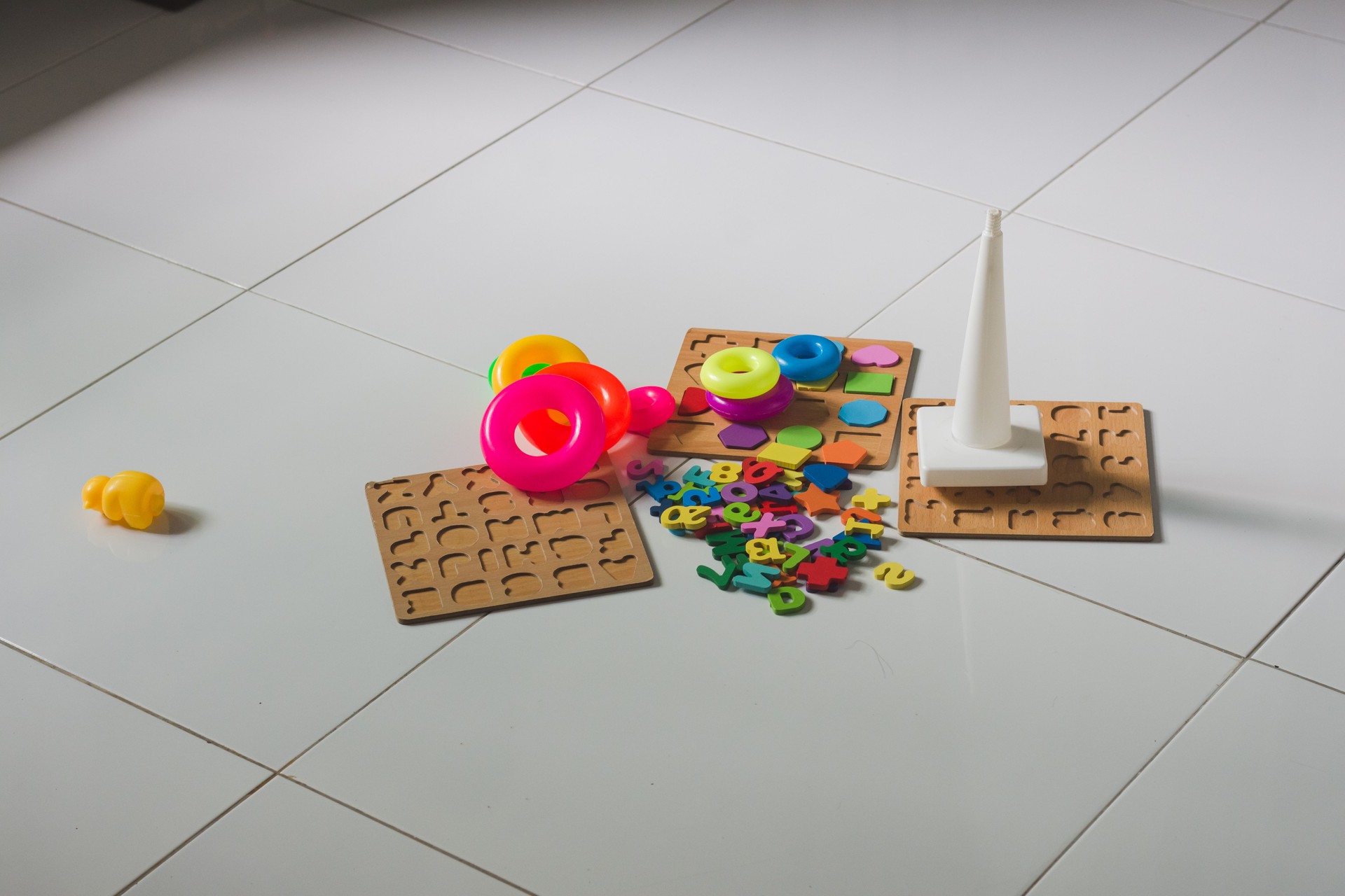 Creative Playtime: Colorful Educational Toys Scattered on the Floor