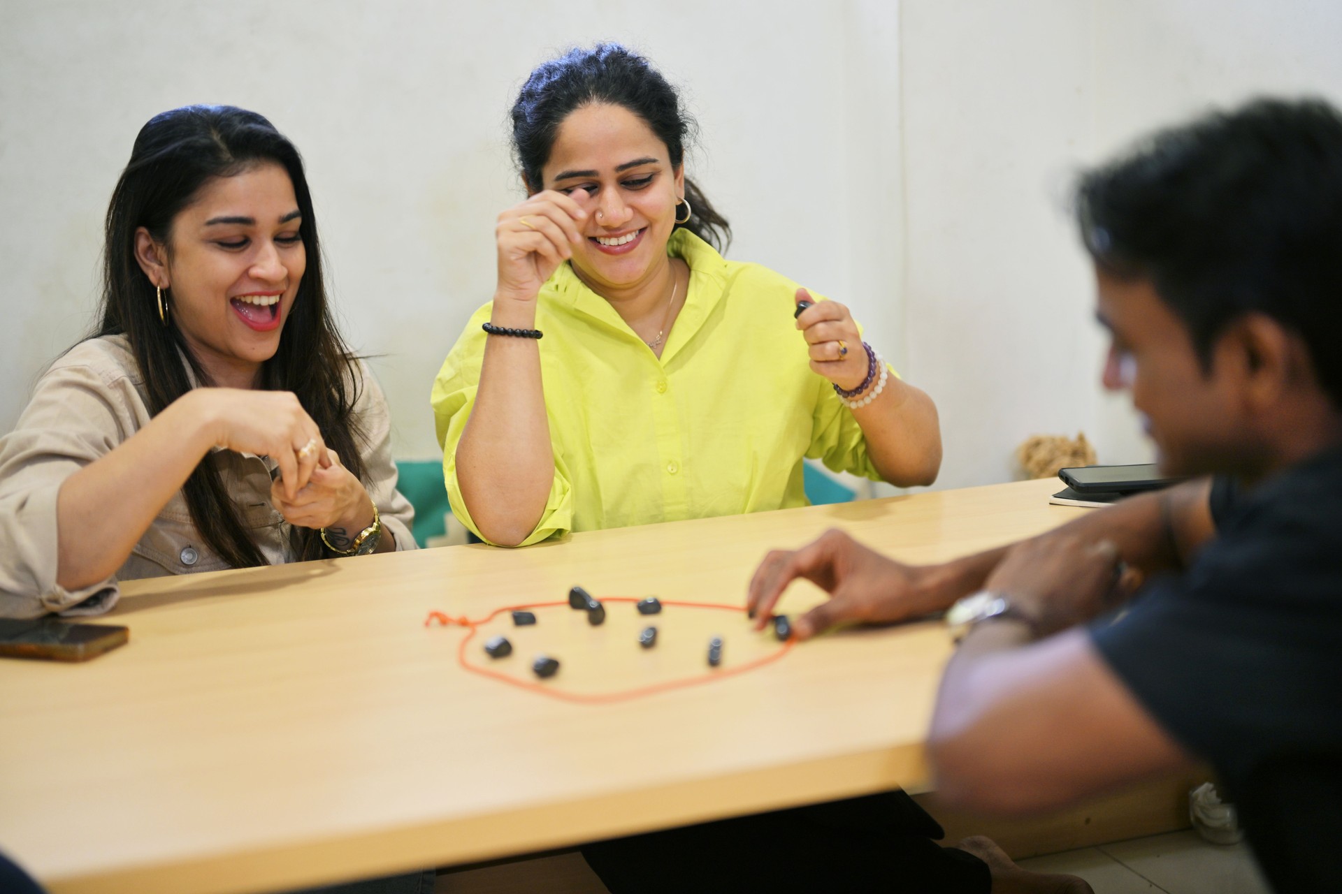 Group of friends are enjoying a lively game session.